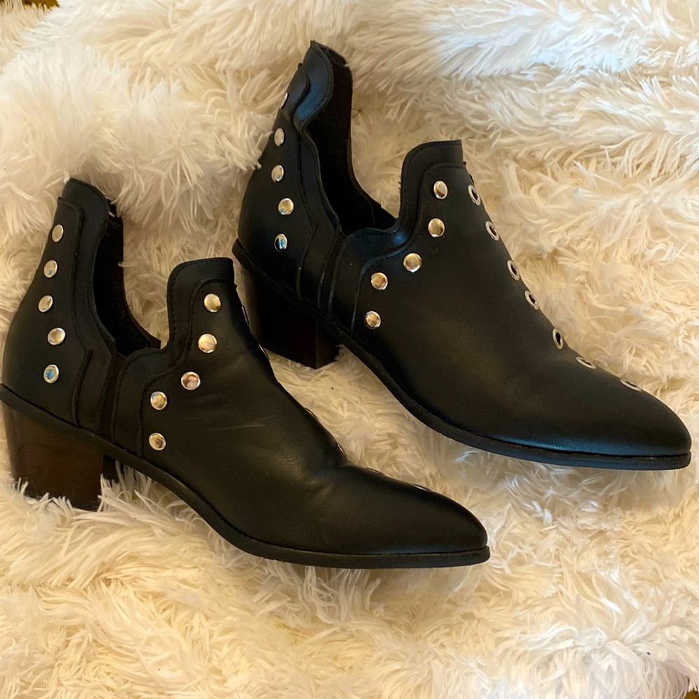 Cute chrome like circles and black soft leather boots with heel